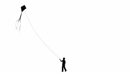 silhouette of a person flying a kite isolated backgroundの写真素材