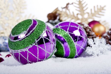 Purple Christmas Decoration on snowの写真素材