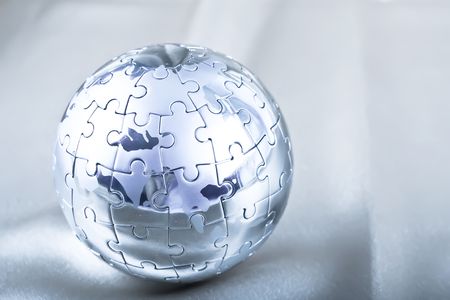 Vibrant Color Metal Puzzle Globe On Satinの写真素材