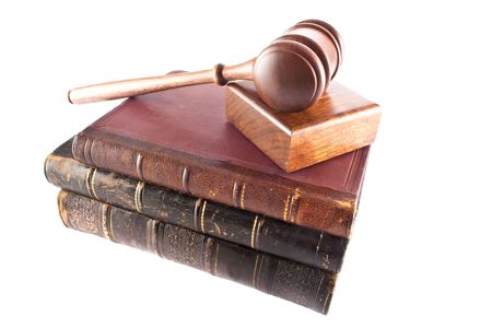 legal concept with old gavel and books on white backgroundの写真素材
