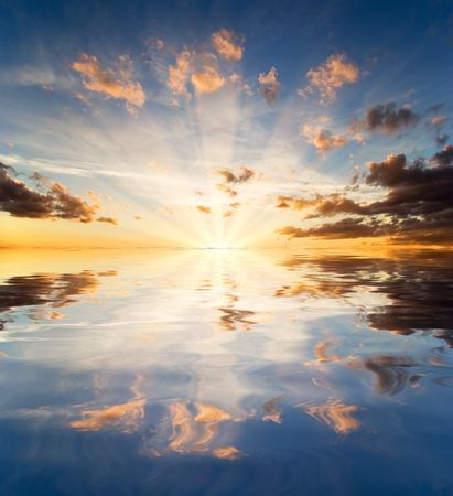 Reflection of the sunset sky in waterの写真素材