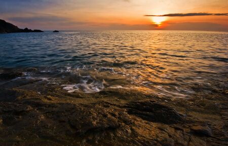 Sunset on the rocks. Siam bay. Province Trat. Koh Chang island. Kingdom Thailand