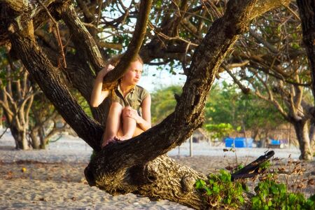 Girl on the beach. Legian beach on Bali island. Indonesiaの写真素材