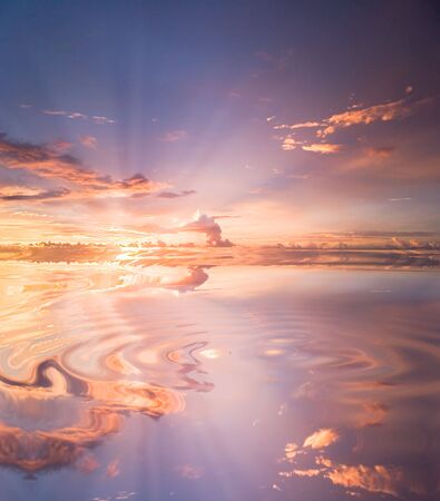Reflection of sunset in waterの写真素材