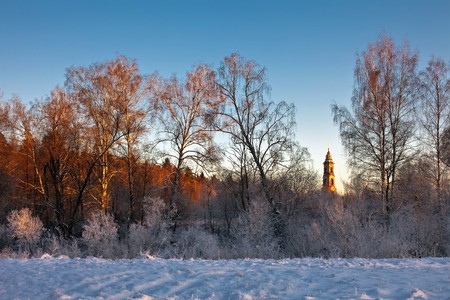 View on church and winter fieldの写真素材