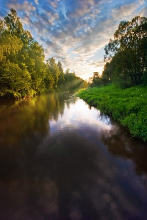 Summer river under blue sky の写真素材
