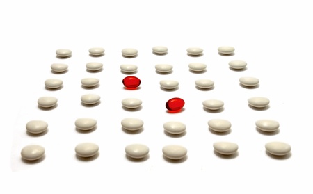 medication pills laying over white background の写真素材