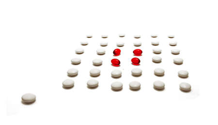 medication pills laying over white background 