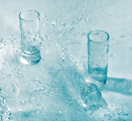 Glasses in splash of water の写真素材