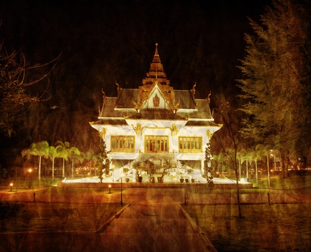 Old thai temple in retro and grunge styleの写真素材
