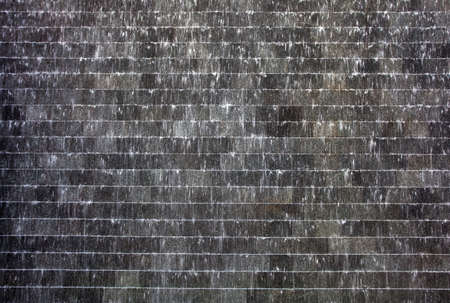 Abstract bricks wall under water drops の写真素材