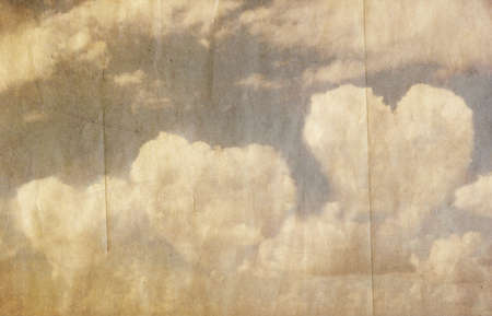 grunge image of blue sky with cloudsの写真素材