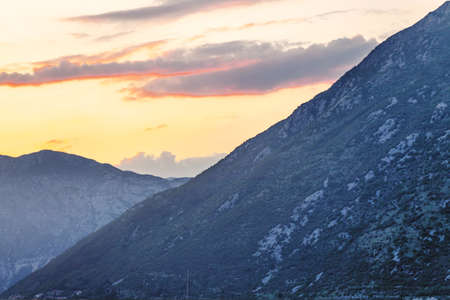 mountain sunset and colored sky with clouds の写真素材