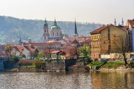 view on old Prague with river under autumn sky