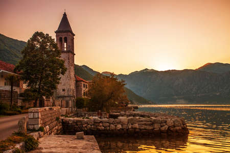  Sunset on the sea with the foggy mountains  Montenegroの写真素材