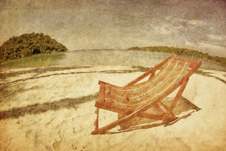  sun beach chair on shore near sea in grunge and retro style の写真素材