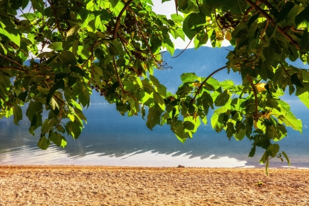 Early misty morning on the beach with sea and mountain views  Kotor bay  Montenegroの写真素材