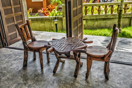 Two old wooden chairs and a table in small resortの写真素材