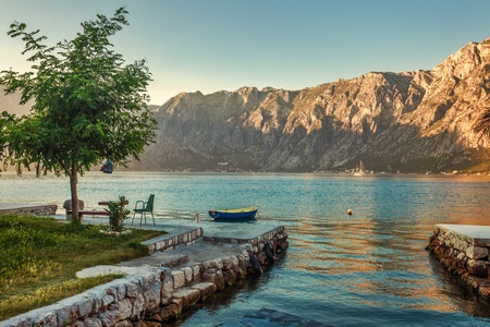 Early misty morning on the beach with sea and mountain views  Kotor bay  Montenegroの写真素材
