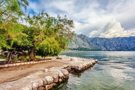 Early misty morning on the beach with sea and mountain views  Kotor bay  Montenegroの写真素材