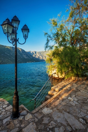 seafront with sea and mountain views in sunlights   Montenegroの写真素材