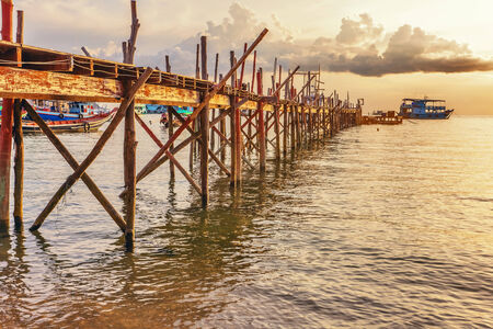 Sunset over the sea  Pier on the foregroundの写真素材