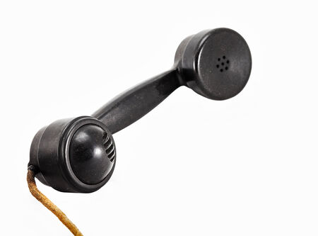 black vintage telephone handset on white