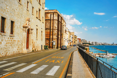 NAPLES, ITALY - JULY 3, 2007: Car rides along the promenade of Naples. Naples is the third largest city of Italy, located 230 km south of Rome, on the Tyrrhenian Sea, not far from volcano Vesuvius.のeditorial素材