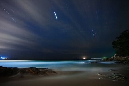Night on the white sand tropical beachの写真素材