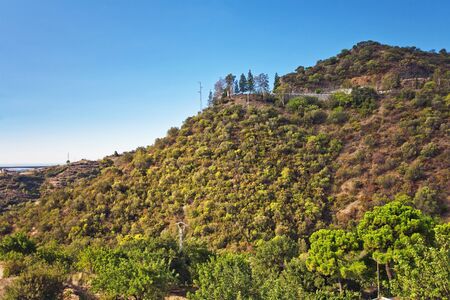 Scenic mountain landscape on blue sky backgroundの写真素材