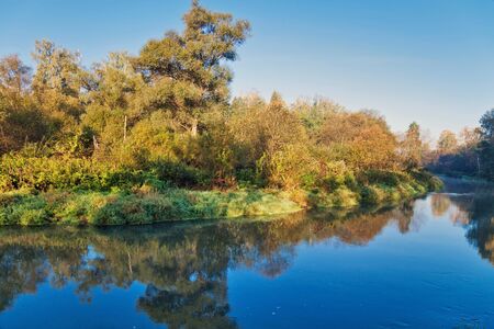 Autumn river in sunrise light