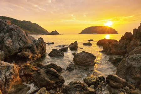 Rocks at topical beach at beautiful sunset. Nature backgroundの写真素材