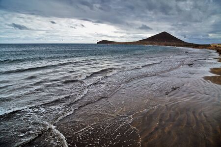 Gloomy weather  on "Playa sur" beach near El Medano town, Canary Islands, Spainの写真素材