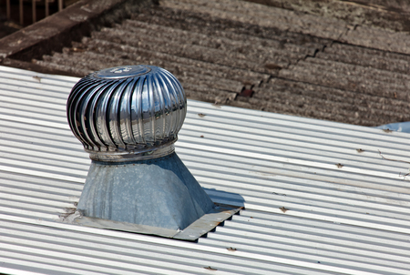 Pipe of ventilation are located on a roof of a residential buildingの写真素材