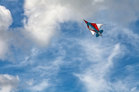 Colorful kite on blue sky backgroundの写真素材