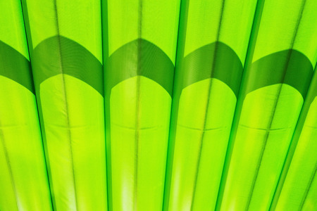 Fragment of green canvas striped marquee roofの写真素材