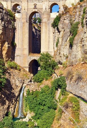 18th Century arched bridge over the El Tajo gorge in Ronda, Andalucia, Spainの写真素材