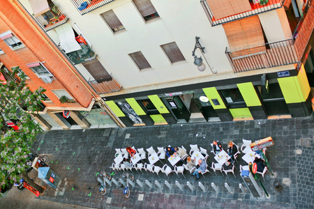 VALENCIA, SPAIN - APRIL 23, 2016: People relax and drink cool drinks on the street in a cafe "Bigornia" in Valencia.のeditorial素材