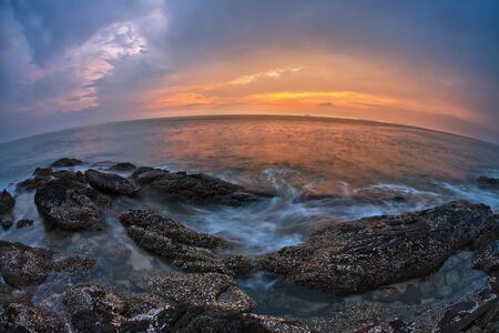 Tropical beach at beautiful sunset in fish-eye lense. Nature background 