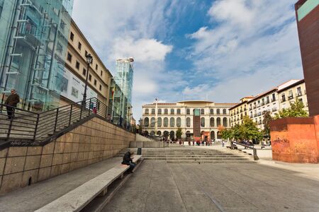 MADRID, SPAIN - OCTOBER 26, 2015 : tired man resting on a bench in front of the Reina Sofia Museum, dedicated to the exhibition of modern and contemporary artのeditorial素材
