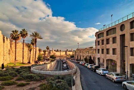 JERUSALEM, ISRAEL - DECEMBER 26, 2016: A road along the wall of the old city of Jerusalem near the...