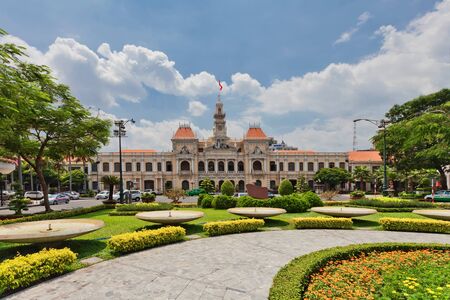 HO CHI MINH, VIETNAM â 28 APRIL, 2014: Building of City People's Committee near of Monument to Ho Chi Minh named "Uncle Ho and children". Building of City People's Committee was built in 1908のeditorial素材