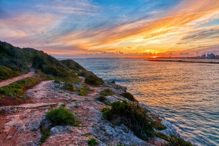 Beautiful seascape with beach, cliffs and ocean. Pintadinho beach. Ferragudo, Lagoa, Algarve, Portugalの写真素材