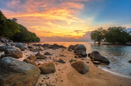 Tropical beach at beautiful sunset. Nature background. Nai Yang beach. Phuket. Thailand