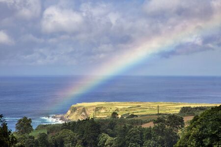 Rainbow over Azores island at Sao Miguel, Portugalの写真素材