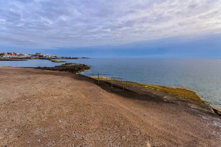 Rocks at topical beach at before sunset.Costa Adeje, Tenerife, Spainの写真素材