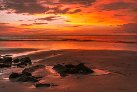 Landscape view of beach, sea at tide and silhouette dark dramatic sunset sky and clouds in the evening. Phuket. Thailandの写真素材