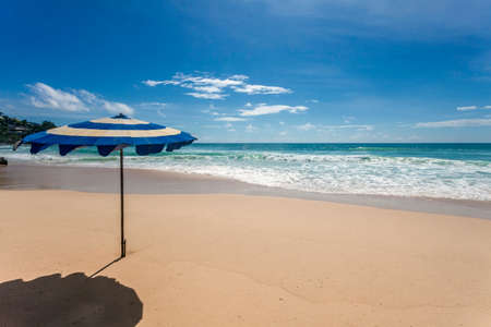 Umbrellas at the sand tropical beach. Andaman sea. Phuket island. Kingdom Thailandの写真素材