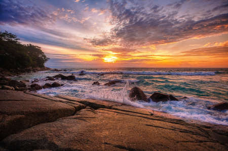 Beautiful sunset on the rock beach. Phuket, Thailandの写真素材