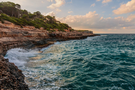 Sunset at small tropical Borgit beach near the famous Mandrago beach. Mallorca island, Spain Mediterranean Sea, Balearic Islands.の写真素材